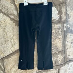 Black Lululemon Crop Split Hem Legging with elastic drawstring size 6